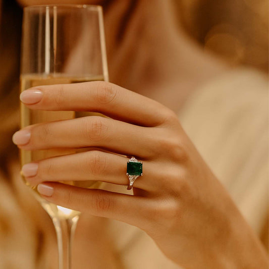 Classic Emerald Cut Emerald Ring with Trillion Diamond Sides